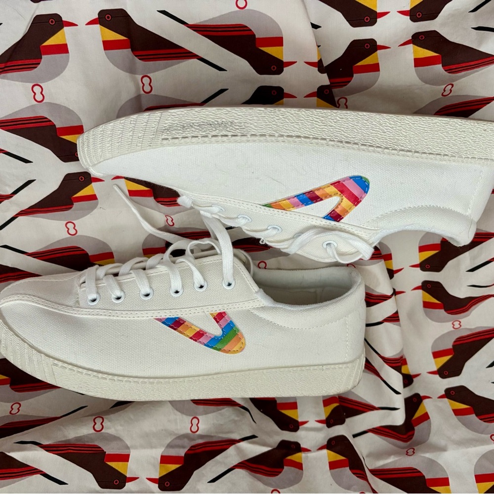 Women’s size 9 Tretorns with multicolored tongue and side logos